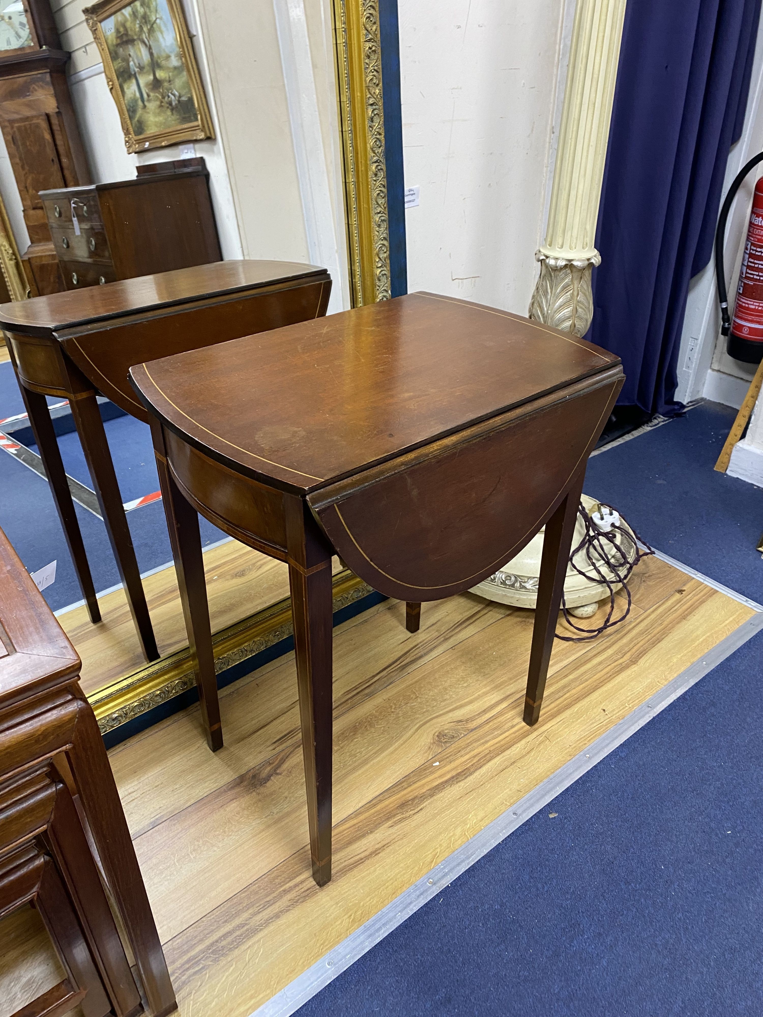 A small inlaid mahogany oval Pembroke table, width 52cm, depth 37cm, height 64cm